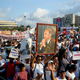 A poster with an image of late Cuban leader Fidel Castro is seen amid the crowd during the May Day rally at Revolution Square in Havana on May 1, 2018.